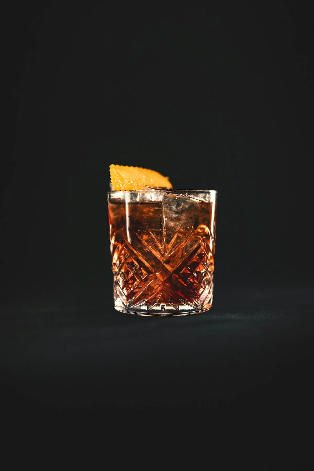 Amber aperitif over ice with a twist of orange